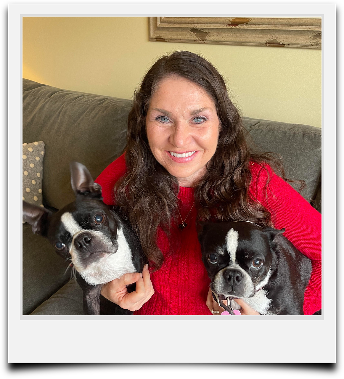 Jackie is a caregiver with Auntie Abby's Professional Pet Sitting pictured with her two Boston Terriers